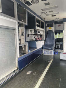 View from rear of module forward. Robinson shutter, CPR bench and attendant's seat Ambulance interior