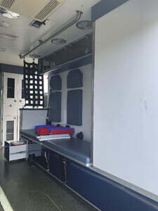 Squad bench with three seat belt equiped stations for additional passengers Interior of ambulance