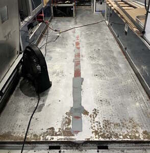 Filling in the stretcher track prior to laying new floor floor with filled in stretcher track