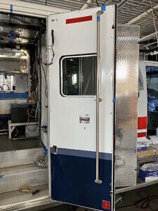 Repurposed grab handle on side entrance door